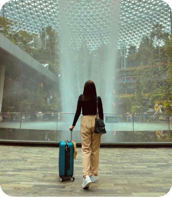 Traveler at Jewel Changi airport with suitcase